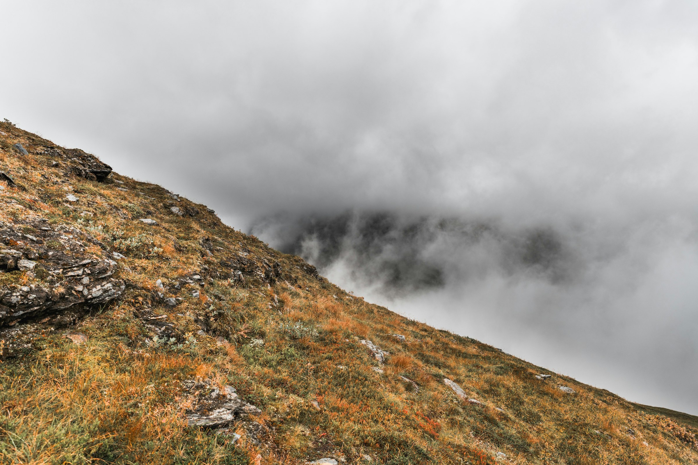Fog rolling over a stony mountainside in Sarek National Park