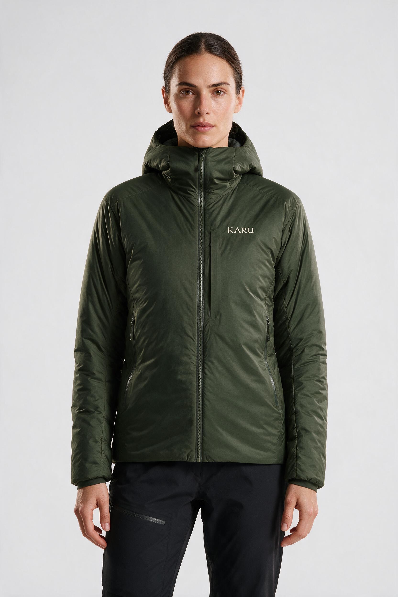 Aktse Insulated in deep moss, worn by a model, studio product shot on a seamless neutral ground