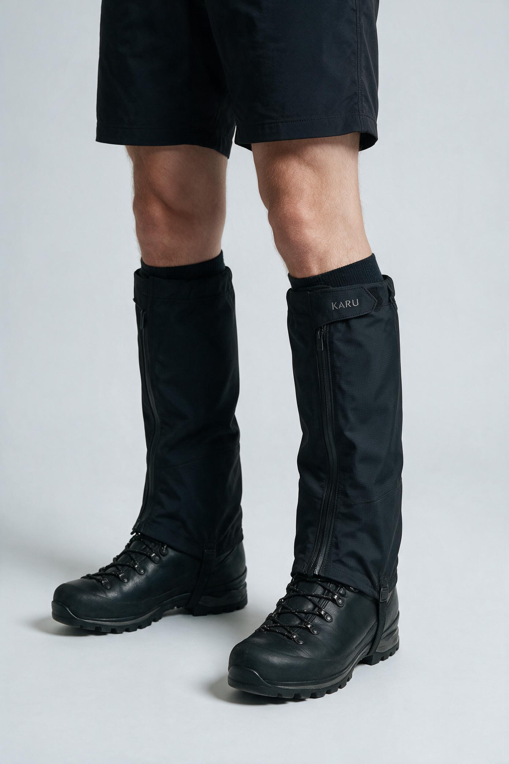 Halti Gaiter in night black, worn by a model, studio product shot on a seamless neutral ground