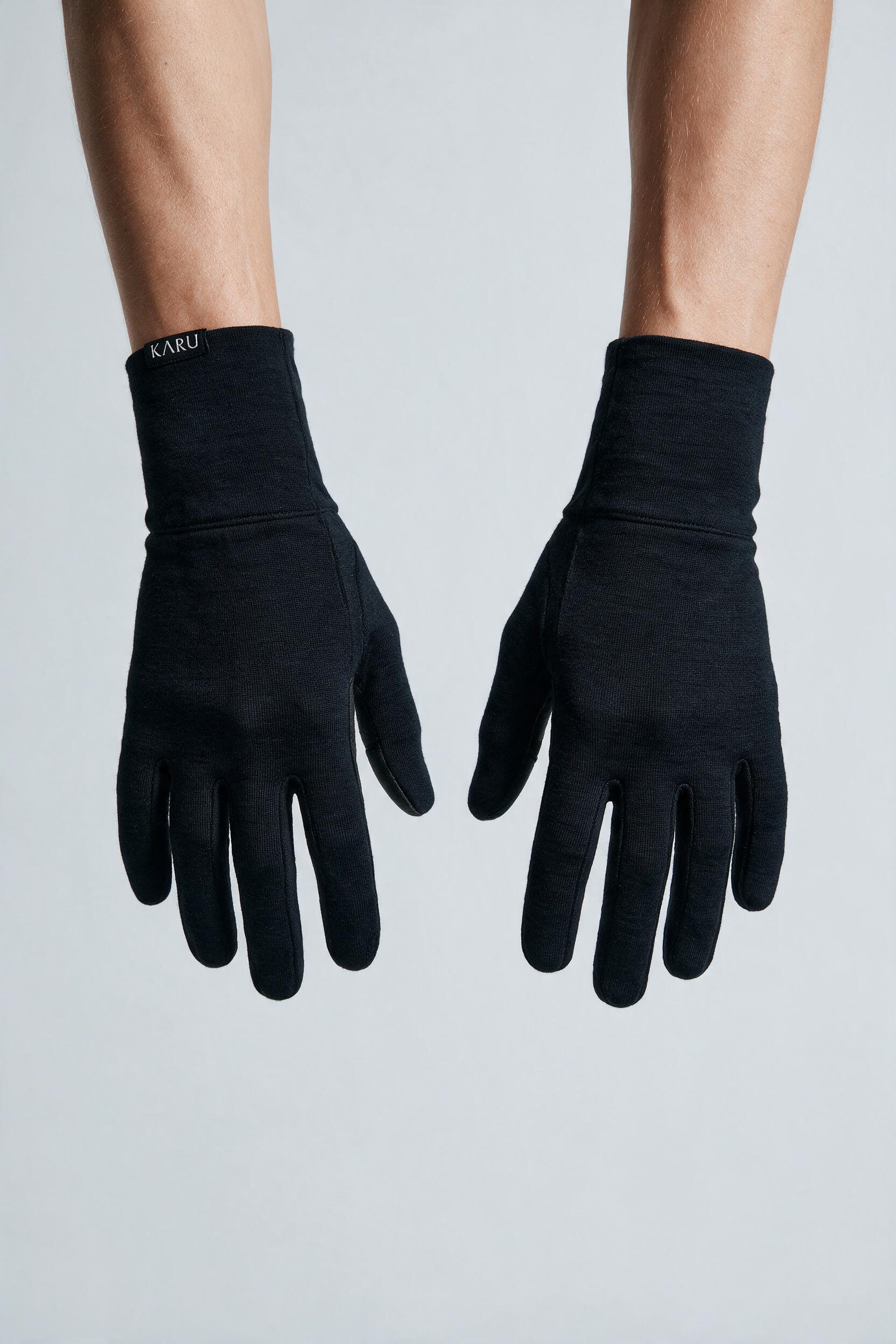 Kärke Gloves in night black, worn by a model, studio product shot on a seamless neutral ground