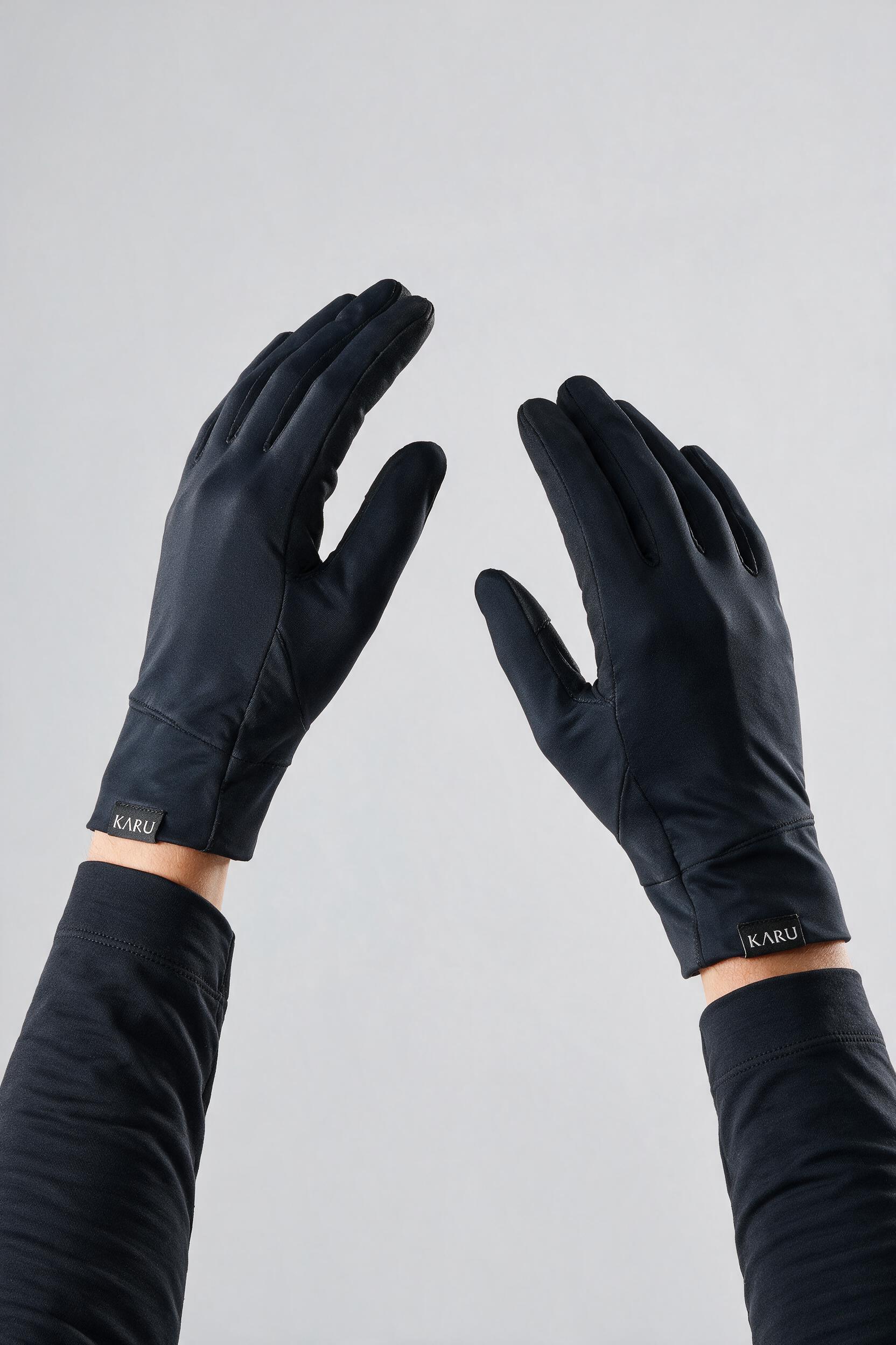Kärke Gloves in night black, worn by a model, studio product shot on a seamless neutral ground