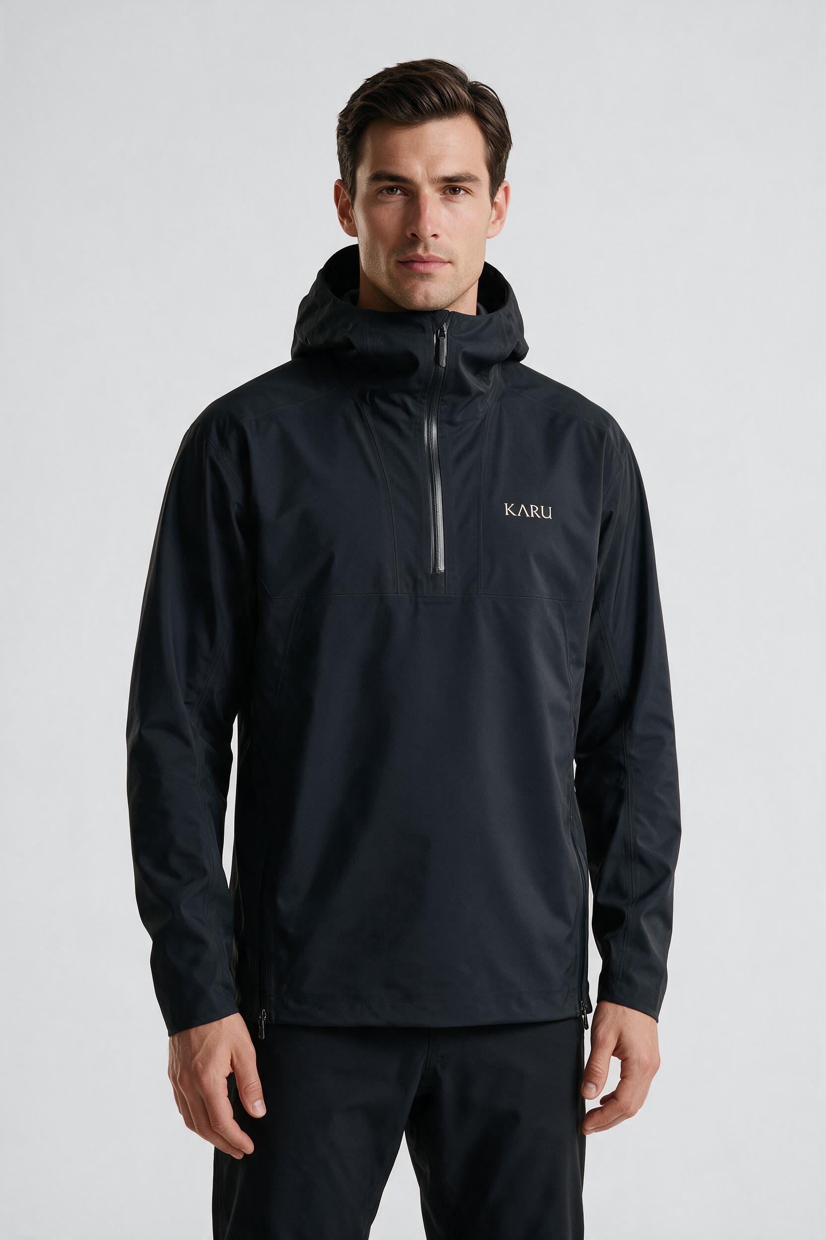 Kårsa Anorak in night black, worn by a model, studio product shot on a seamless neutral ground