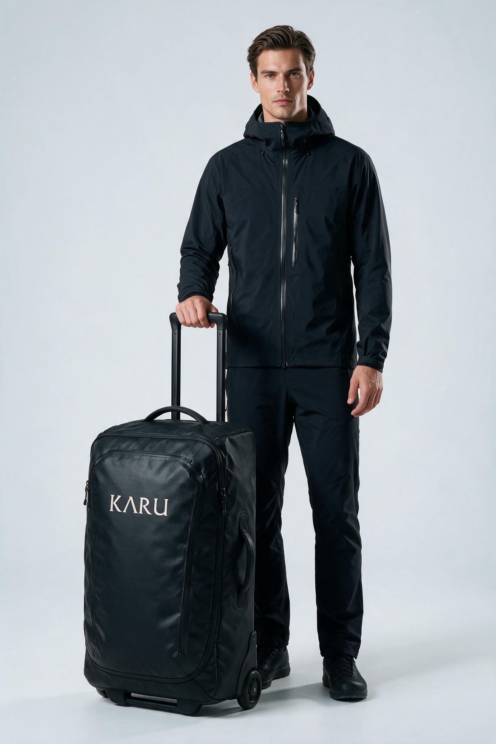 Kvikkjokk Roller 90 pack in night black, worn on the back, studio product shot on a seamless neutral ground