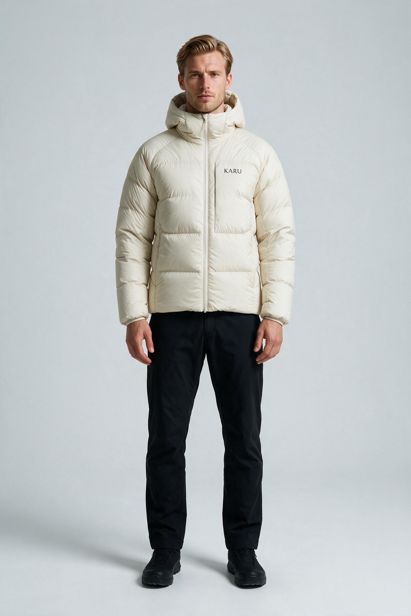 Nallo Down Ecru in ecru off-white, worn by a model, studio product shot on a seamless neutral ground