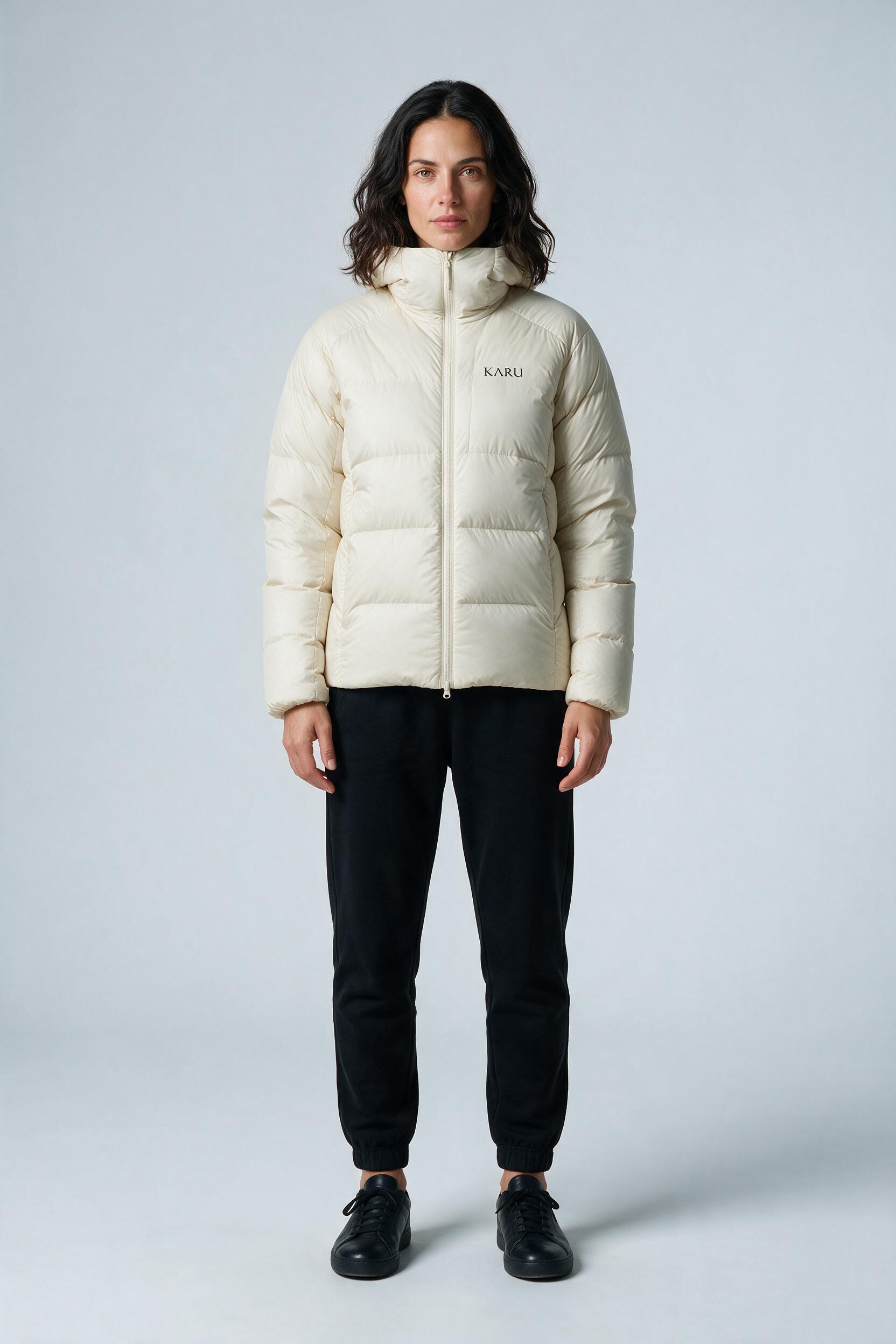 Nallo Down Ecru in ecru off-white, worn by a model, studio product shot on a seamless neutral ground