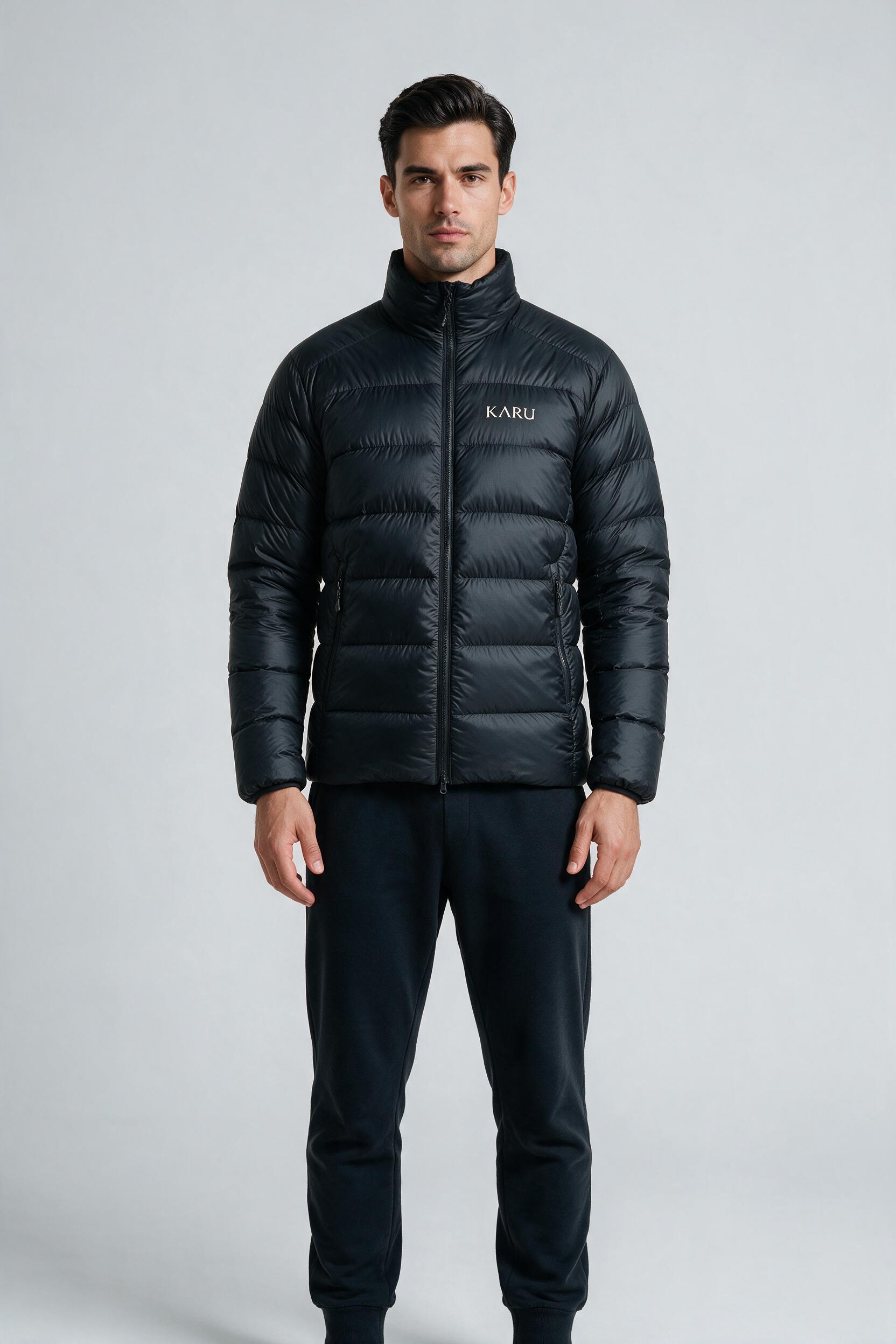Nallo Down in night black, worn by a model, studio product shot on a seamless neutral ground