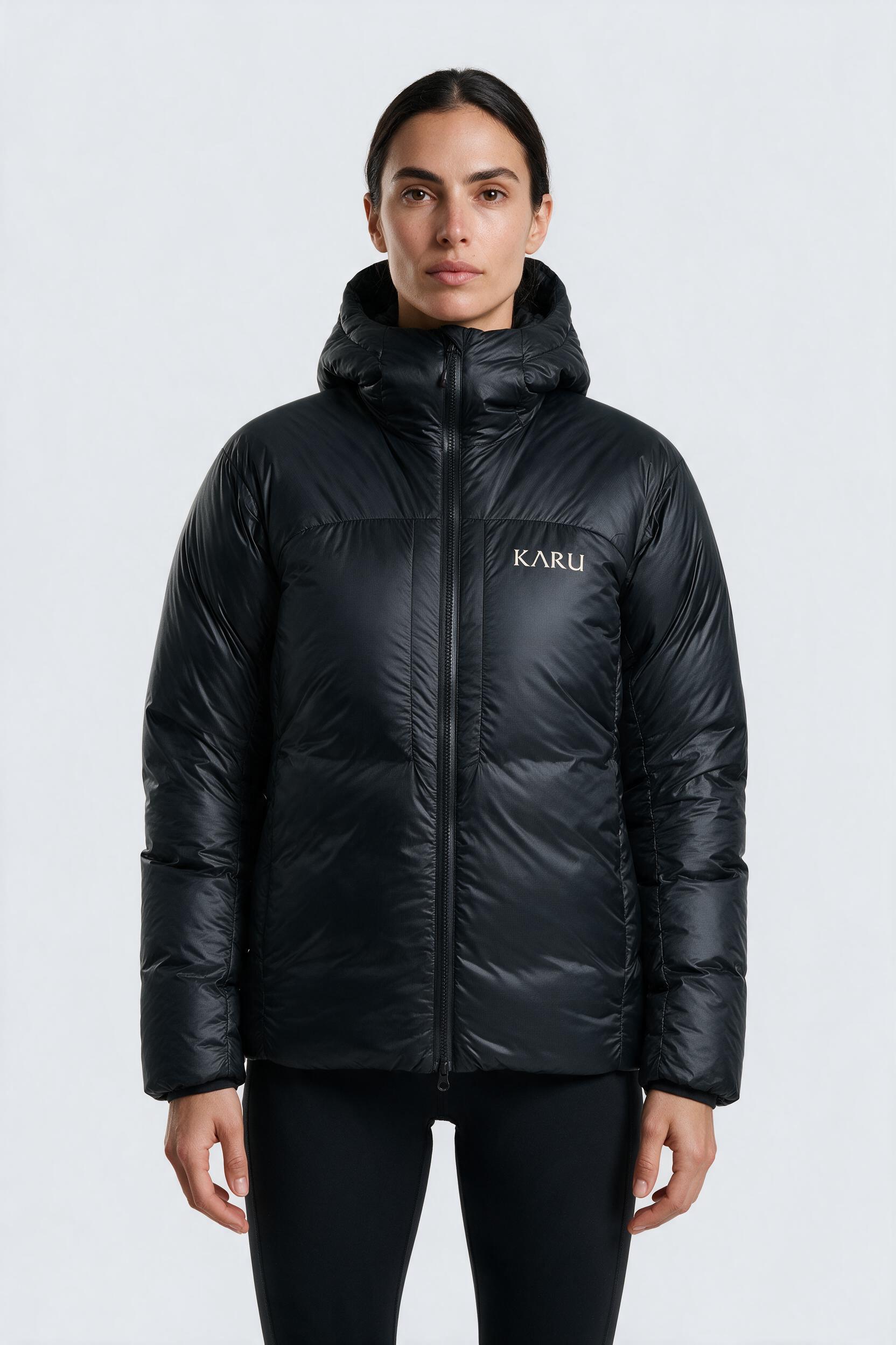 Nallo Down in night black, worn by a model, studio product shot on a seamless neutral ground