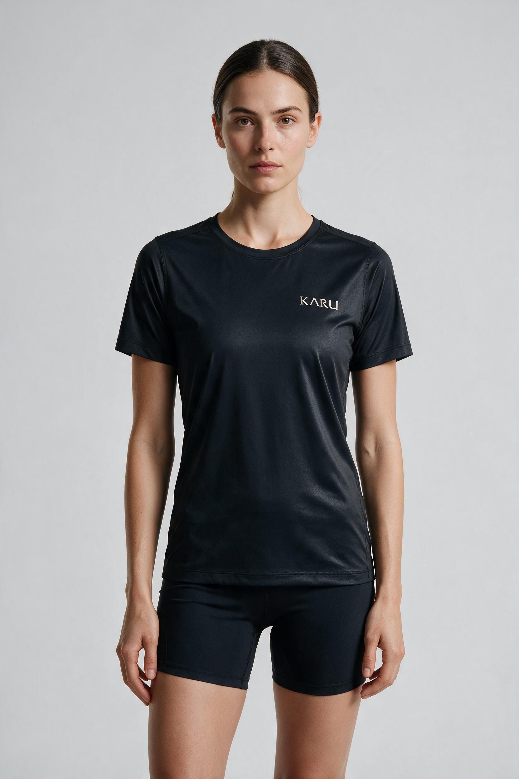 Pallas Tee in night black, worn by a model, studio product shot on a seamless neutral ground