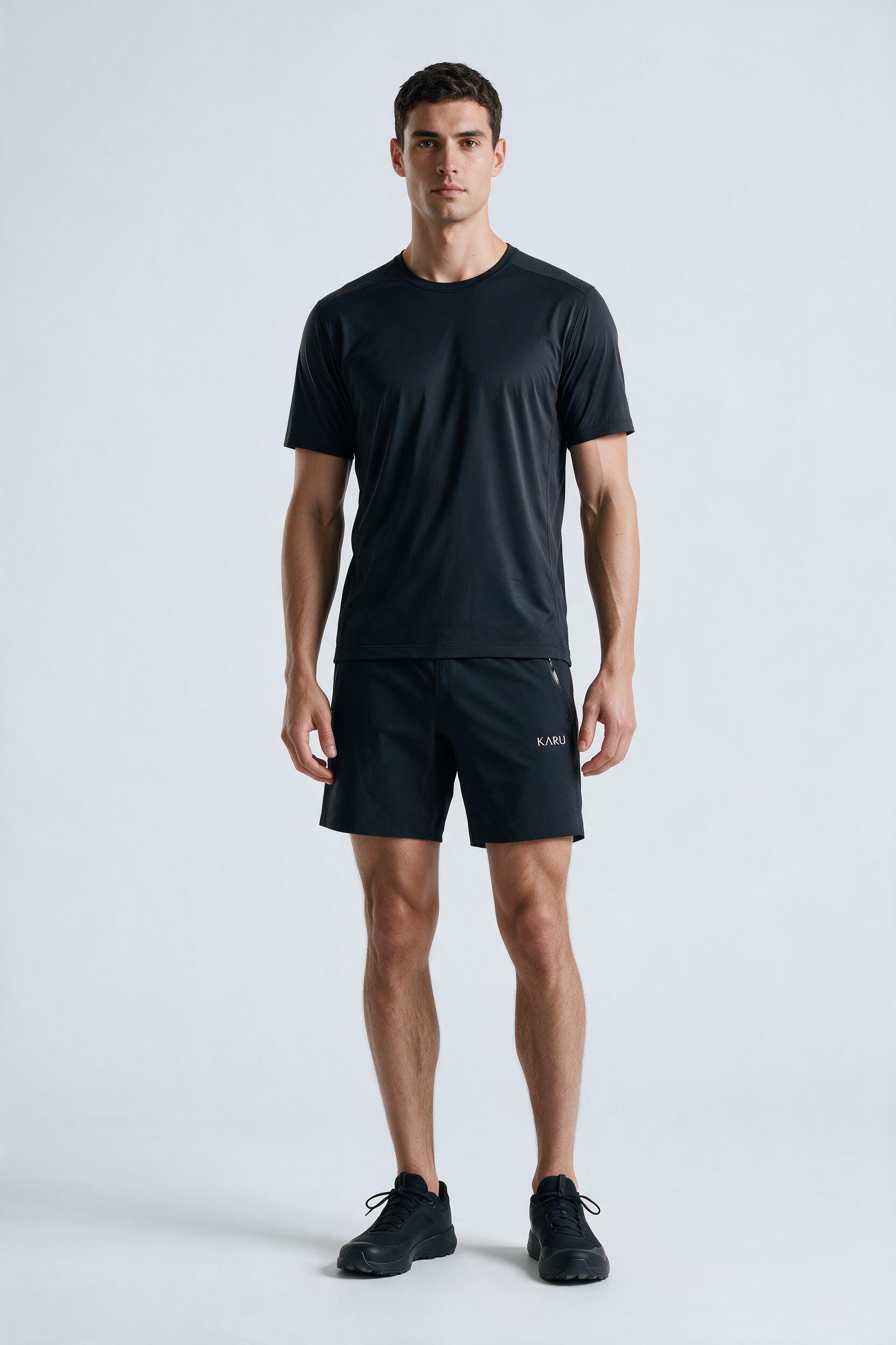 Sálka Short in night, worn by a model, studio product shot on a seamless neutral ground