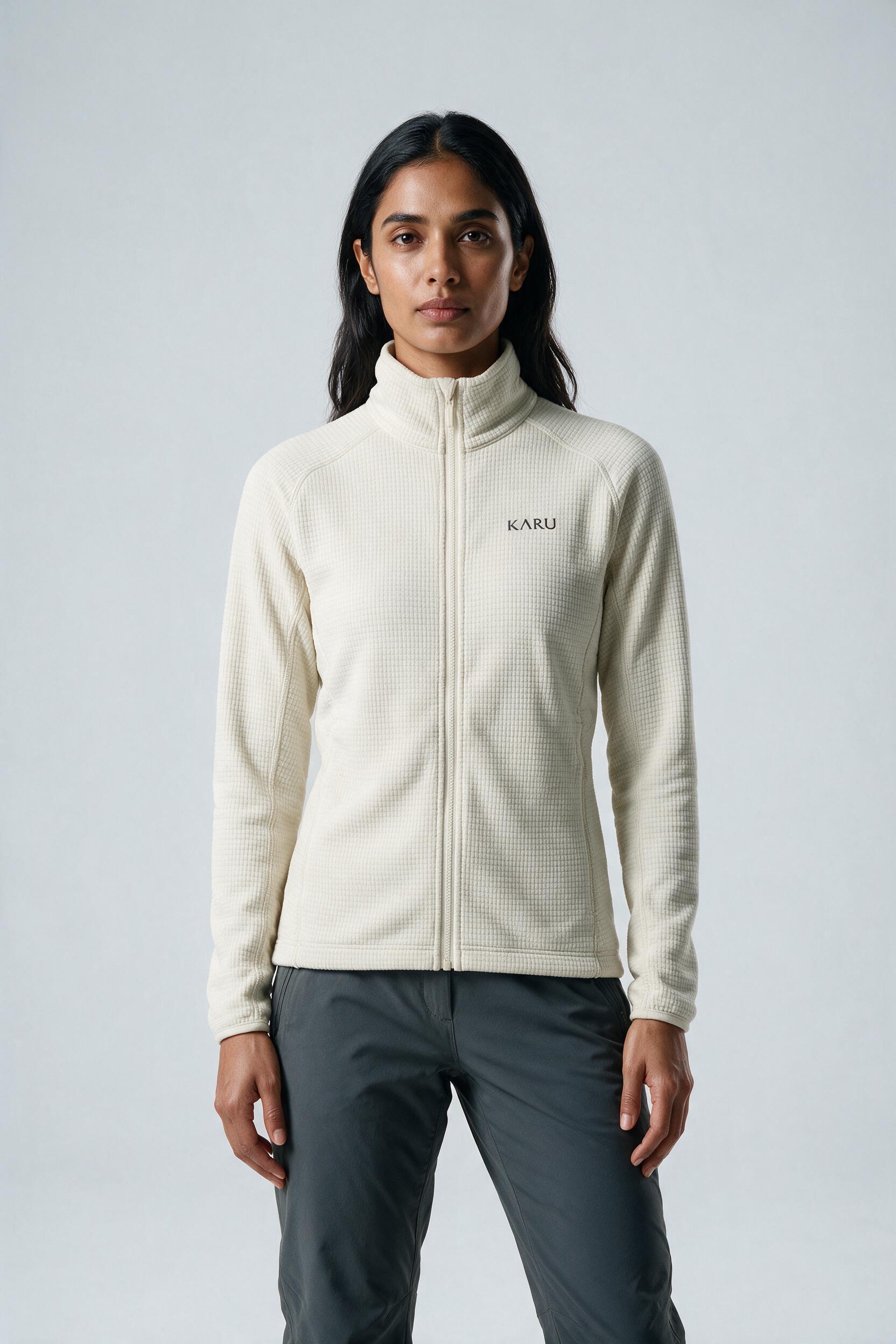 Salto Fleece Ecru in ecru off-white, worn by a model, studio product shot on a seamless neutral ground