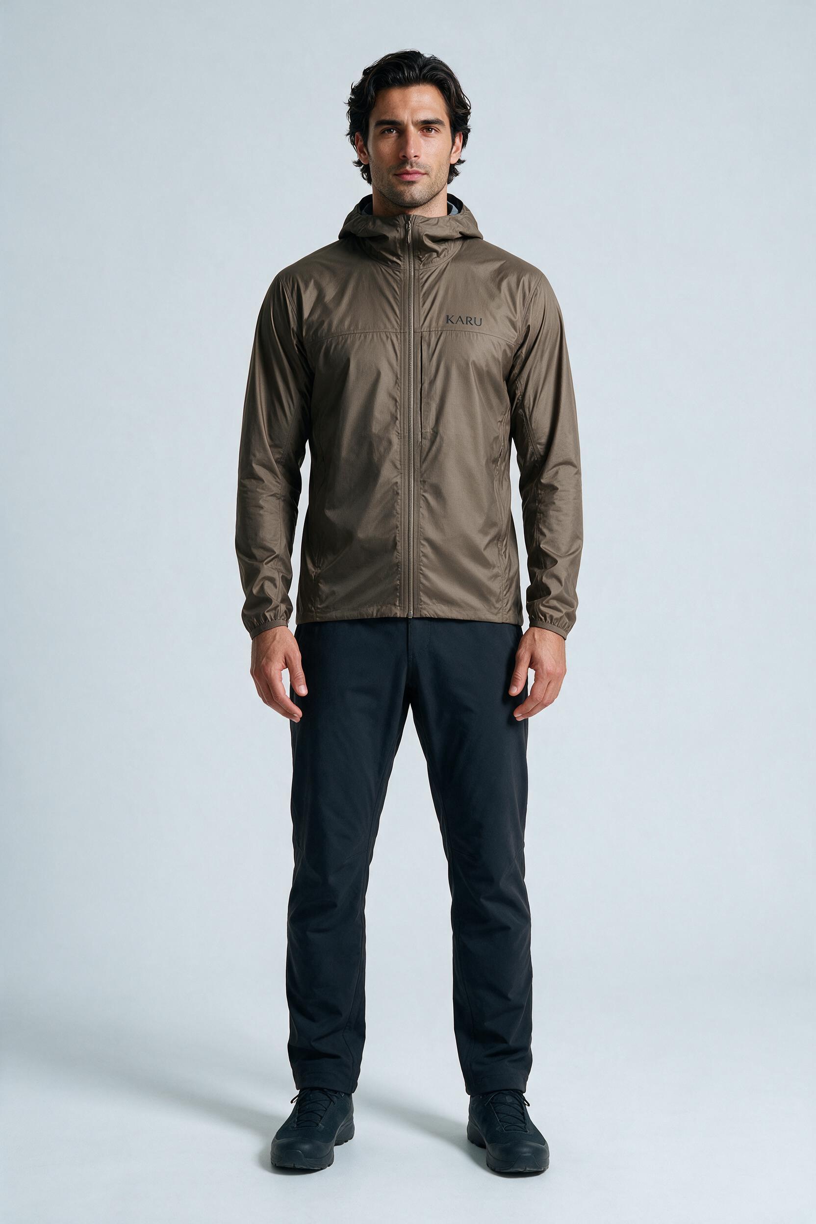 Singi Shell Taupe in warm taupe brown, worn by a model, studio product shot on a seamless neutral ground