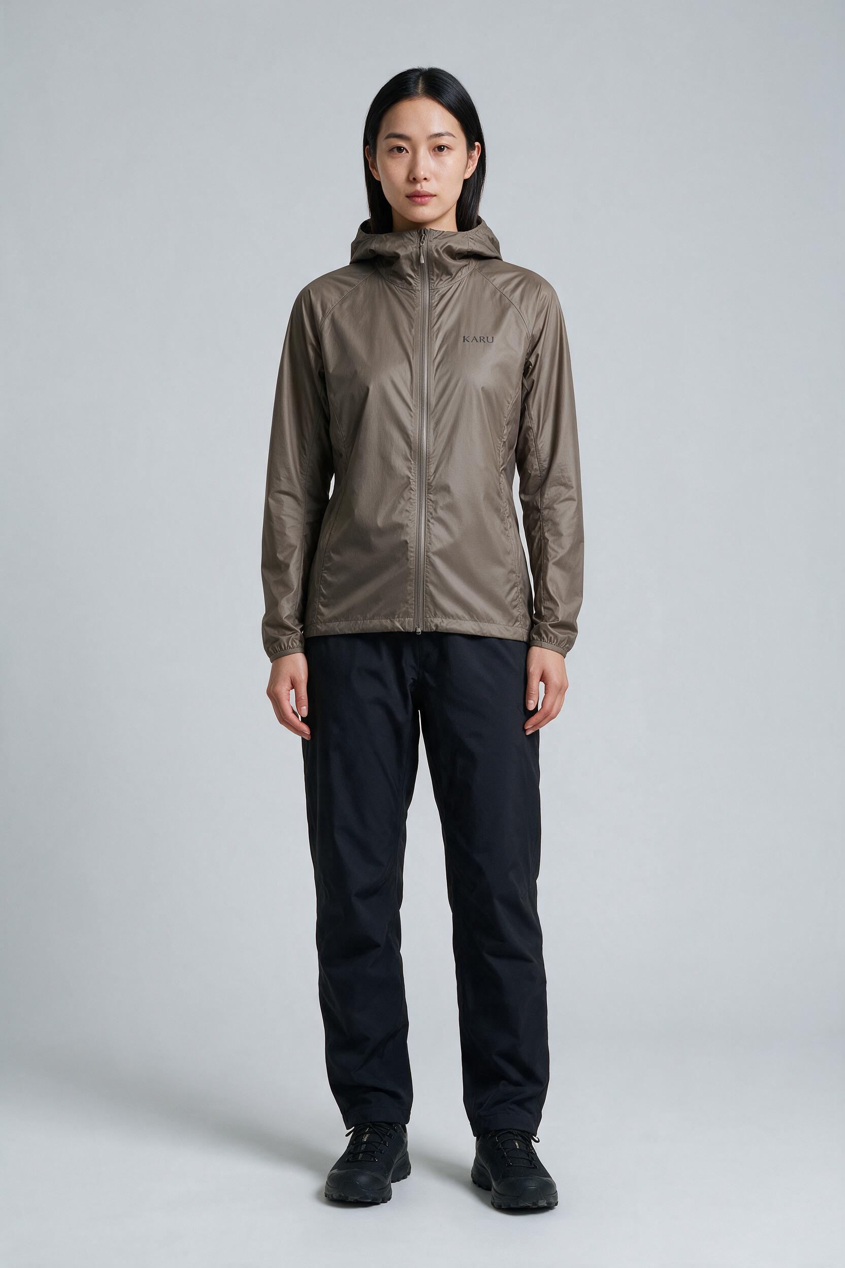 Singi Shell Taupe in warm taupe brown, worn by a model, studio product shot on a seamless neutral ground