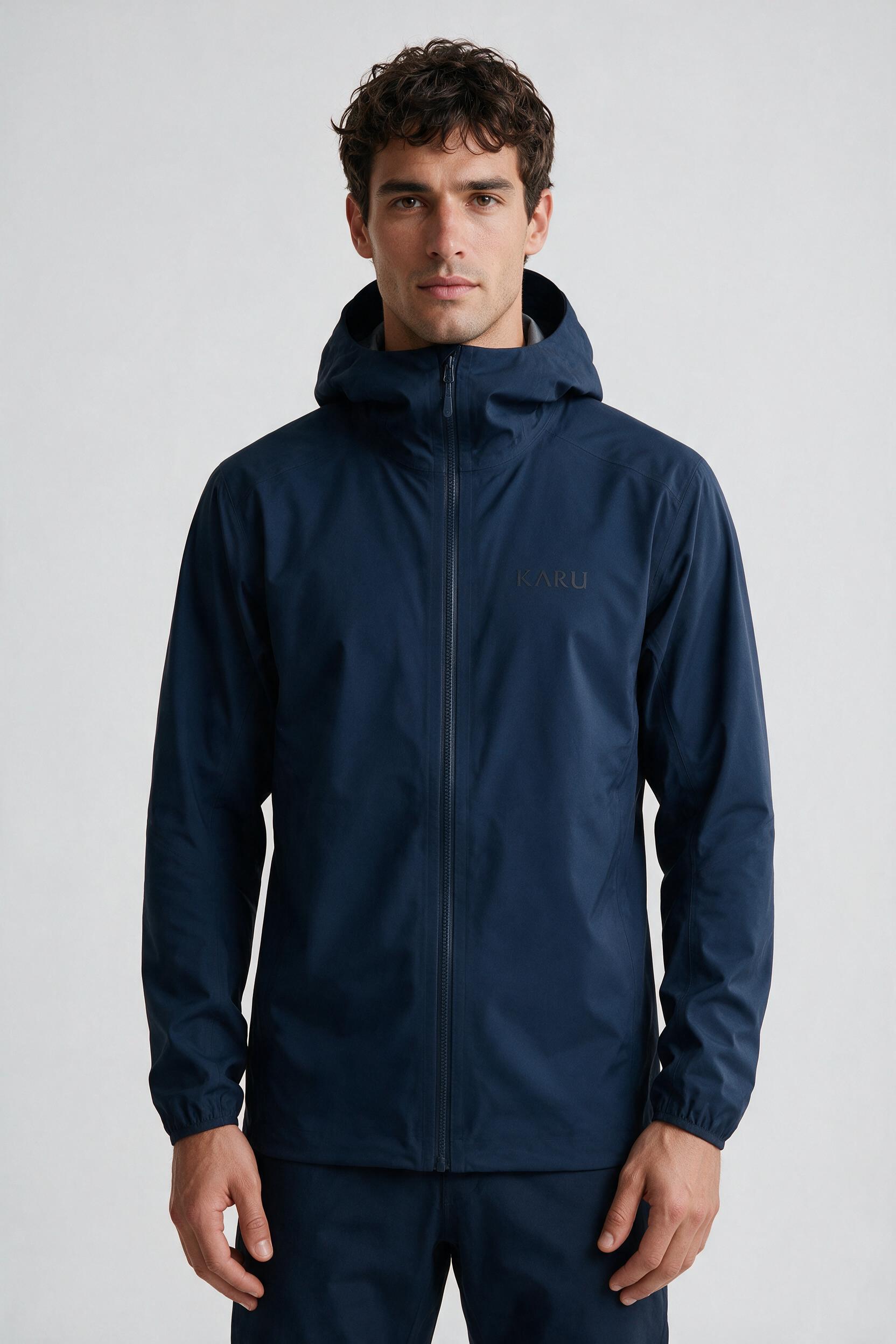 Tarfala Shell Navy in deep navy, worn by a model, studio product shot on a seamless neutral ground