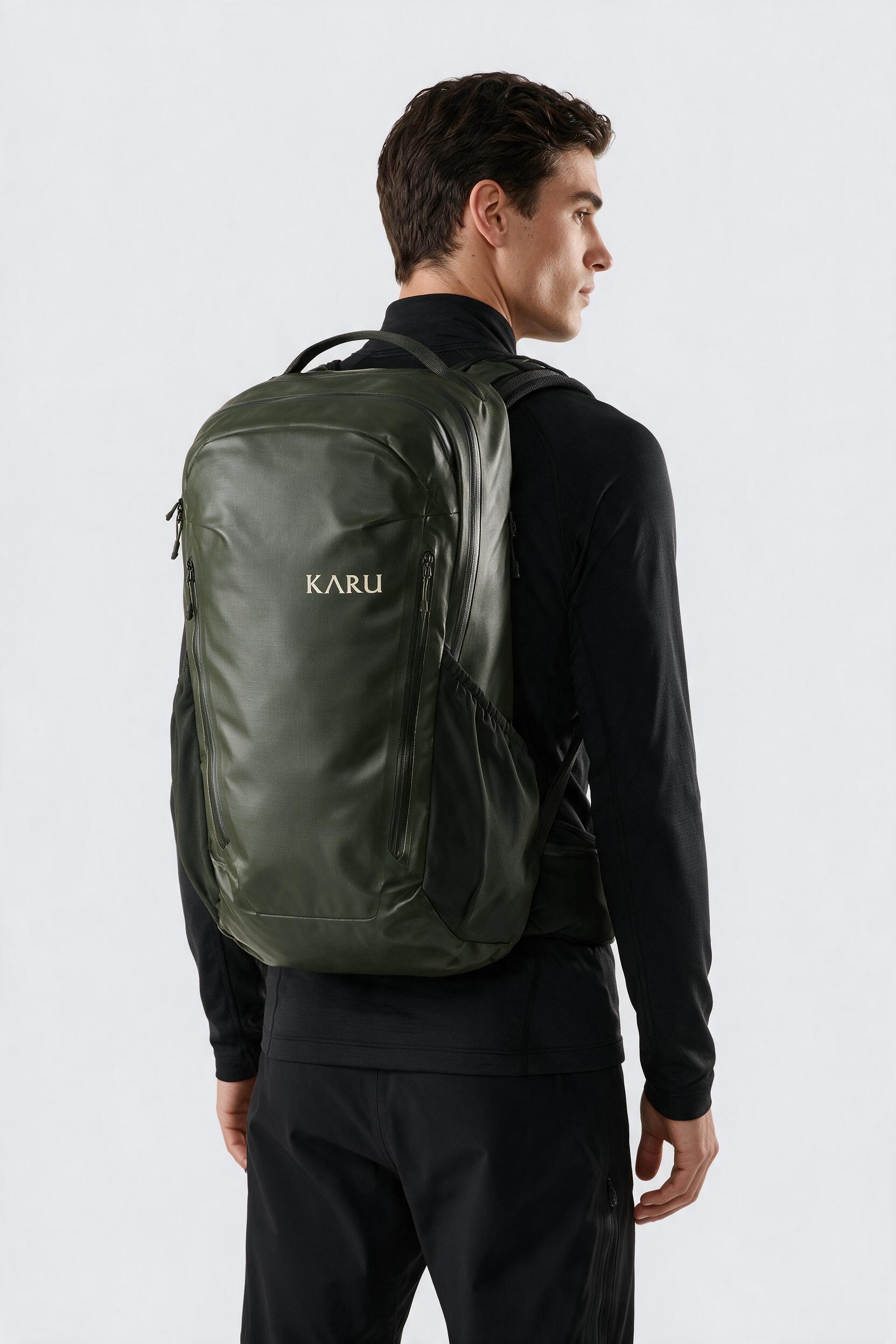 Teusa 45 pack in deep moss, worn on the back, studio product shot on a seamless neutral ground