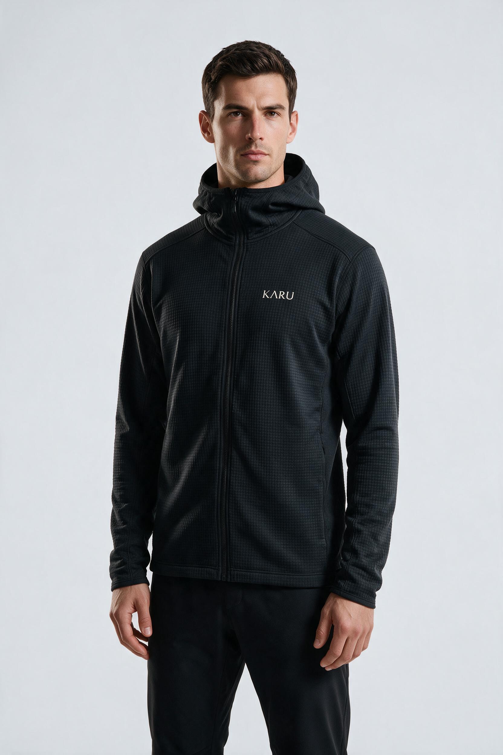 Torne Hoodie in night black, worn by a model, studio product shot on a seamless neutral ground