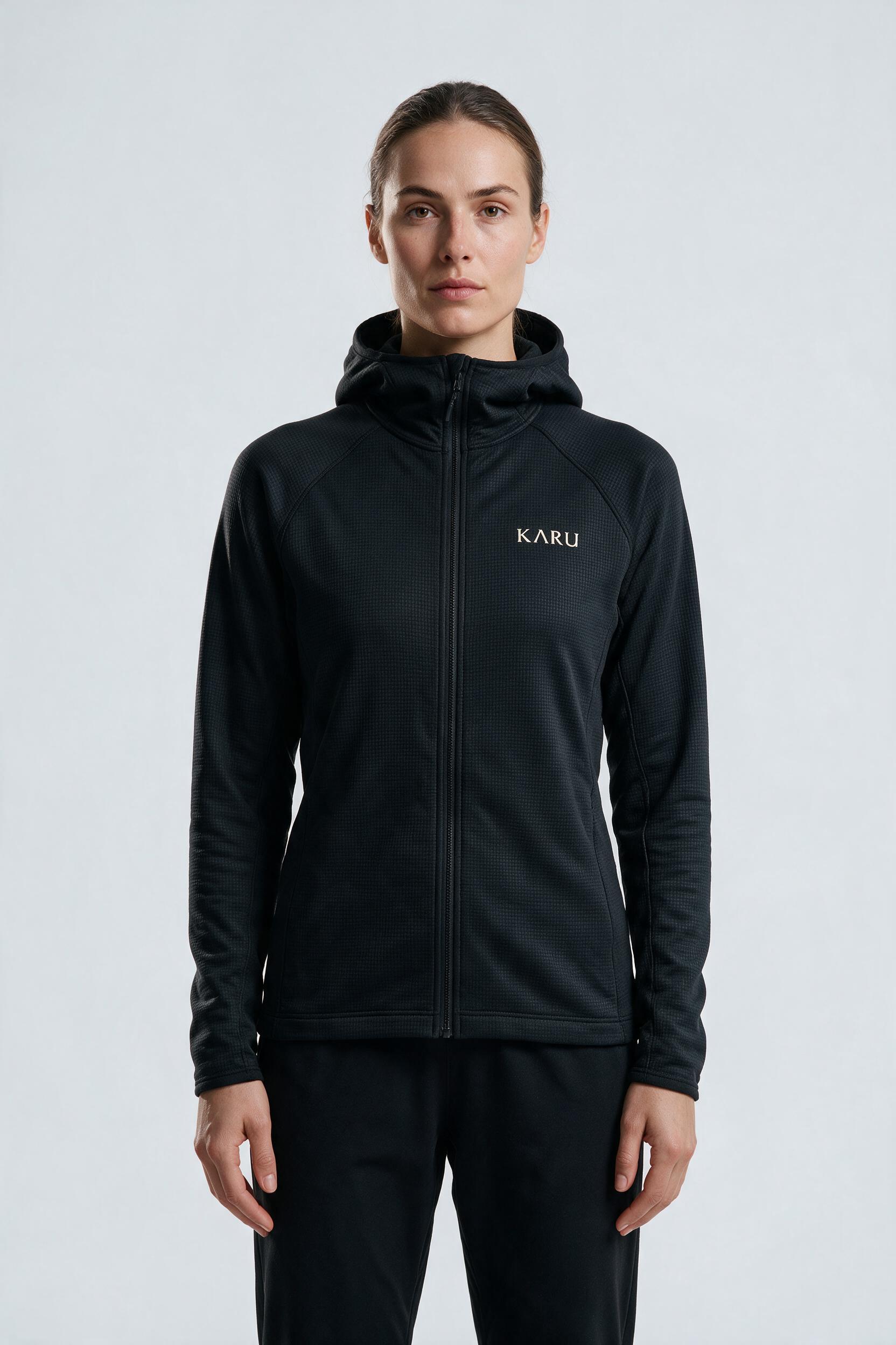 Torne Hoodie in night black, worn by a model, studio product shot on a seamless neutral ground